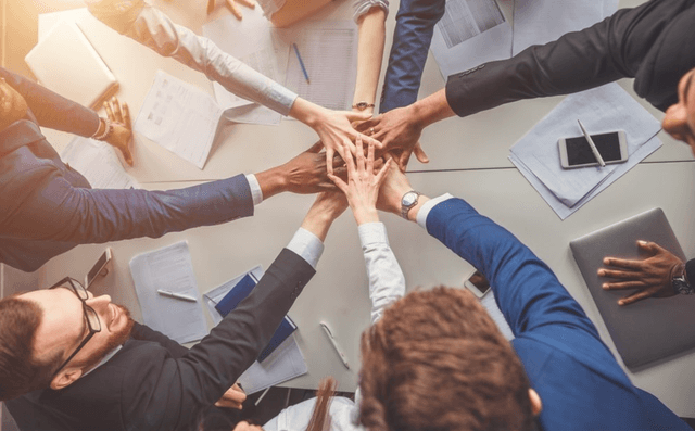 team members after a meeting displaying strong organisational culture
